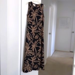 Black sleeveless dress with beige palm tree design